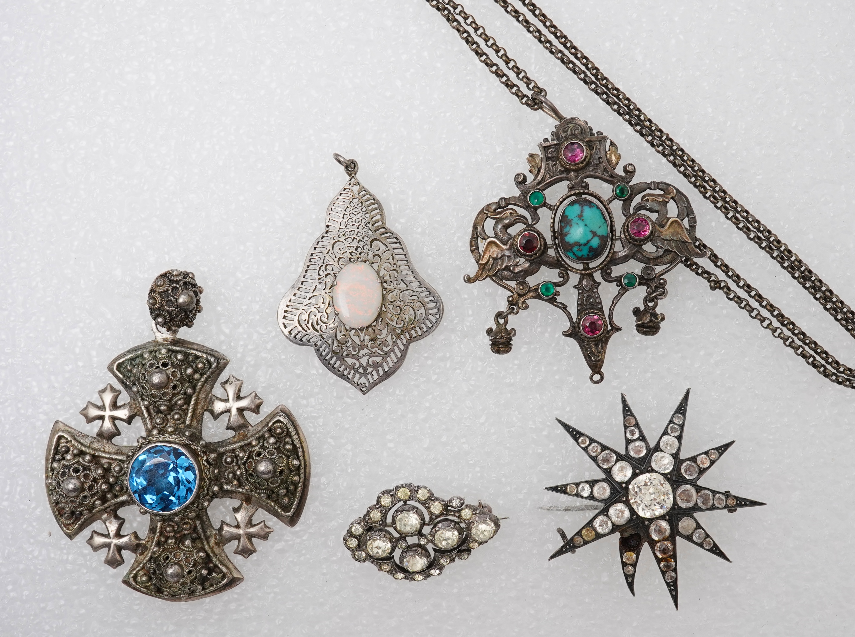 A group of jewels, comprising: a late 19th century and later Renaissance revival-style pendant set with an oval turquoise cabochon, circular-cut garnets and circular-cut green chalcedony, mounted in silver, length 6cm, s
